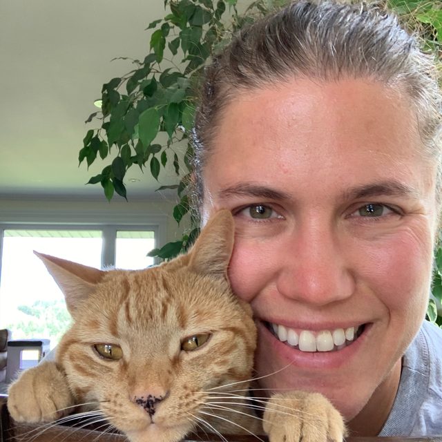 Dr. Erin MacDonald with her orange tabby Sonny